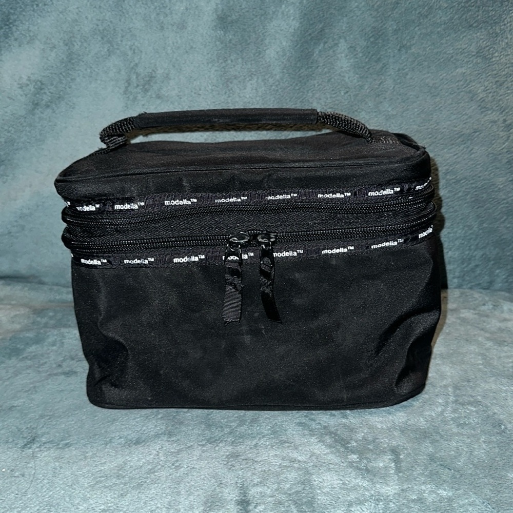 Modella toiletry black and white zippered case damaged
